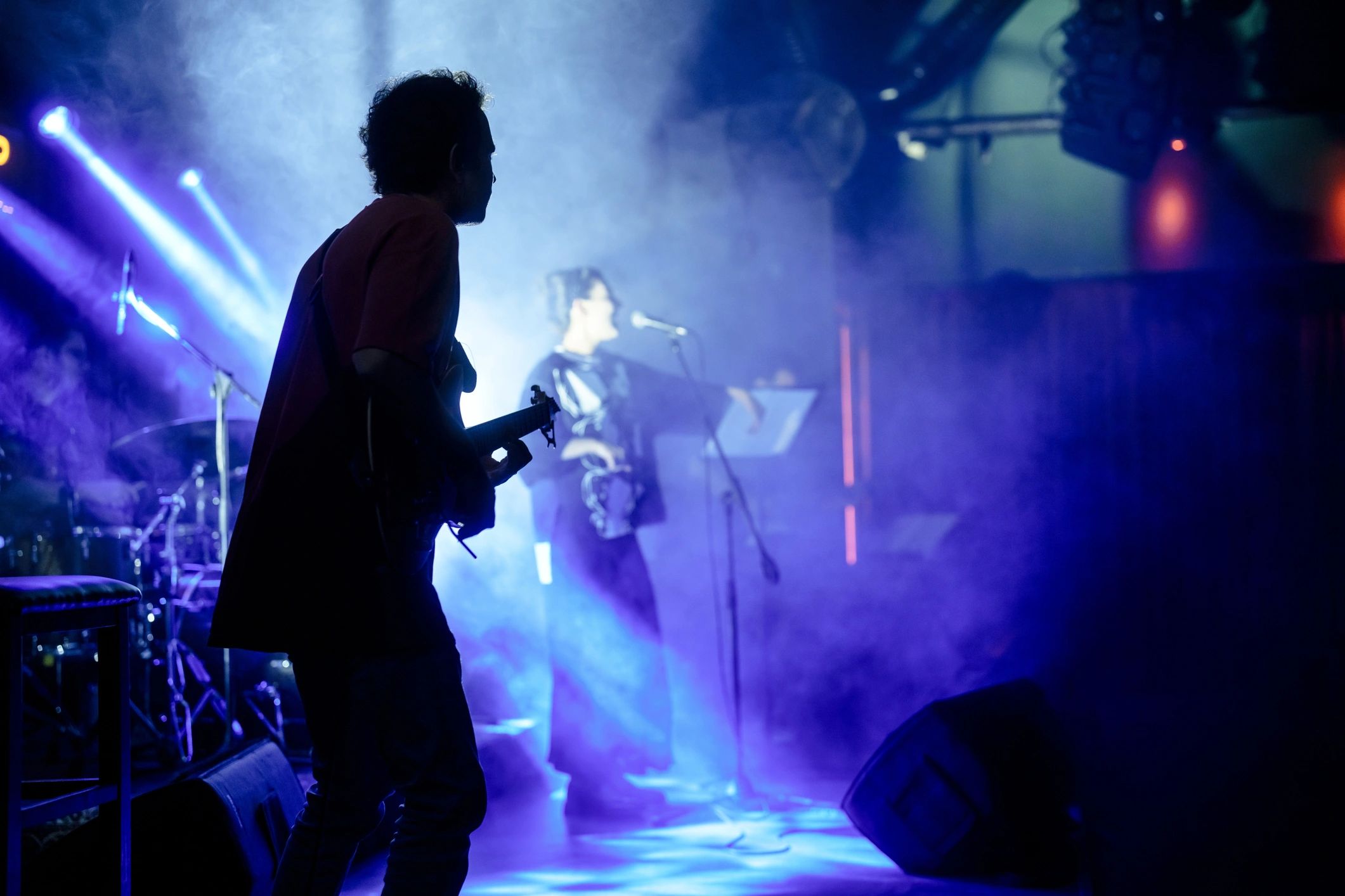 Live entertainment stage production with lighting and performers