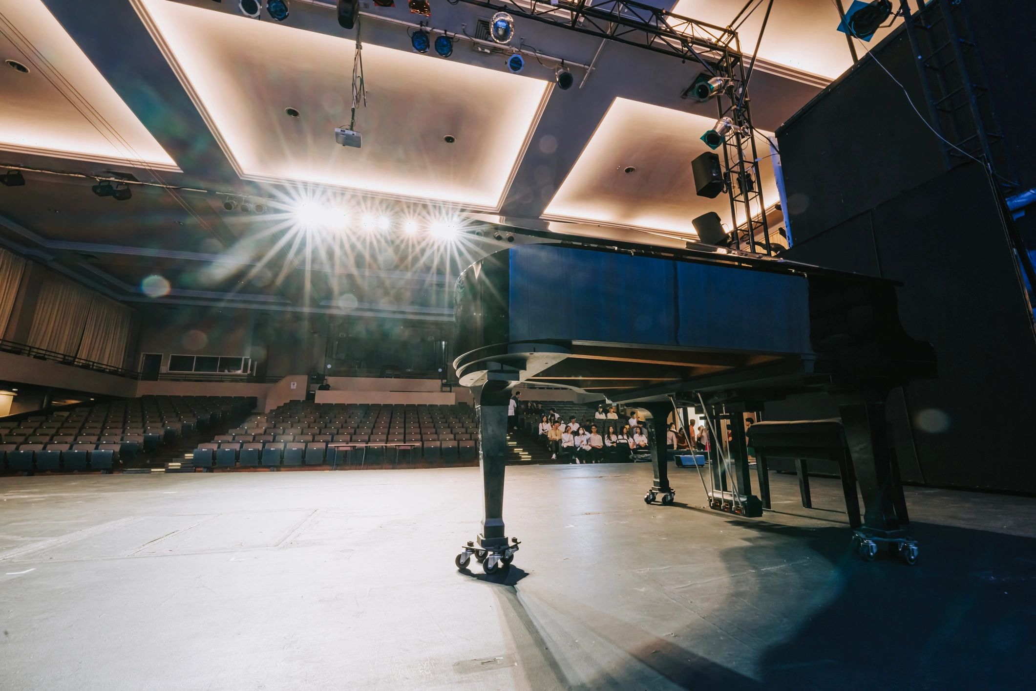 live entertainment event, stage production, dramatic lighting, audience